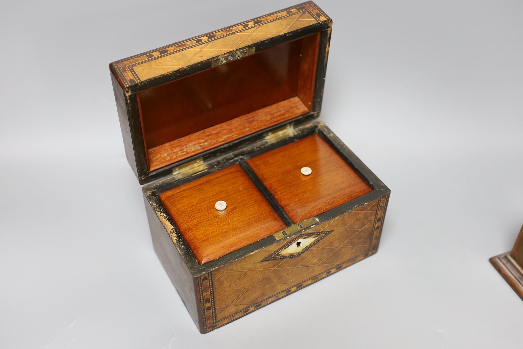 A Victorian walnut and marquetry tea caddy and an inlaid mahogany mantel timepiece, box 20 cms wide 13 cms high